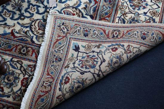 A Nain part silk carpet, 11ft 2in by 8ft.